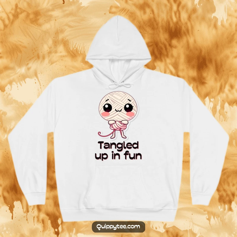 Funny happy thread character playfully tied in a knot, bringing comfort and cheerful humor to this hoodie.